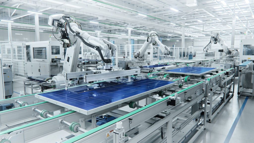 Wide Shot of Solar Panel Production Line with Robot Arms at Modern Bright Factory. Solar Panels are being Assembled on Conveyor.