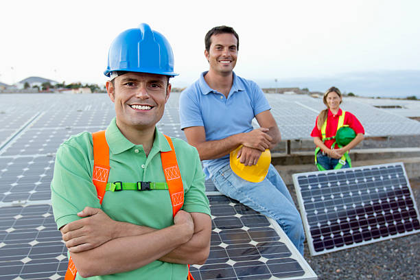 Workers at a renewable energy plan. Jobs that produce energy in responsible and sustainable way