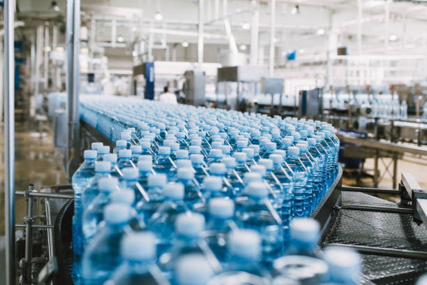 Water bottling line for processing and bottling carbonated water into bottles.